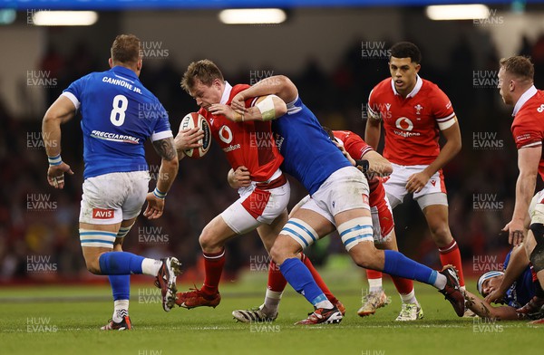 160324 - Wales v Italy - Guinness 6 Nations 2024 - Nick Tompkins of Wales is tackled by Michele Lamaro of Italy 