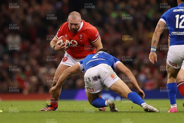 160324 - Wales v Italy - Guinness 6 Nations 2024 - Dillon Lewis of Wales is tackled by Giacomo Nicotera of Italy 