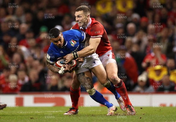 160324 - Wales v Italy - Guinness 6 Nations 2024 - Monty Ioane of Italy is tackled by George North of Wales 