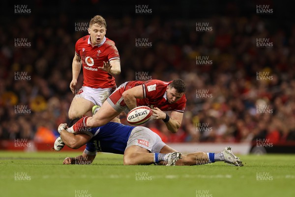160324 - Wales v Italy - Guinness 6 Nations 2024 - Elliot Dee of Wales is tackled by Niccolo Cannone of Italy 