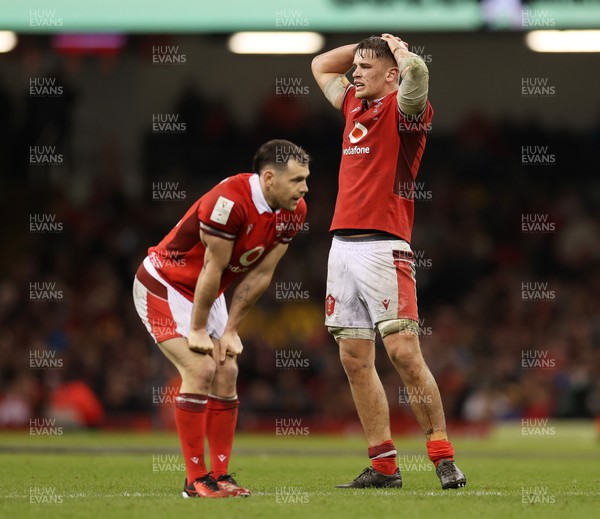 160324 - Wales v Italy - Guinness 6 Nations 2024 - Dejected Tomos Williams and Alex Mann of Wales 