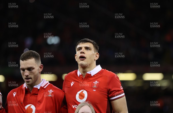 160324 - Wales v Italy - Guinness 6 Nations 2024 - George North and Dafydd Jenkins of Wales sing the anthem