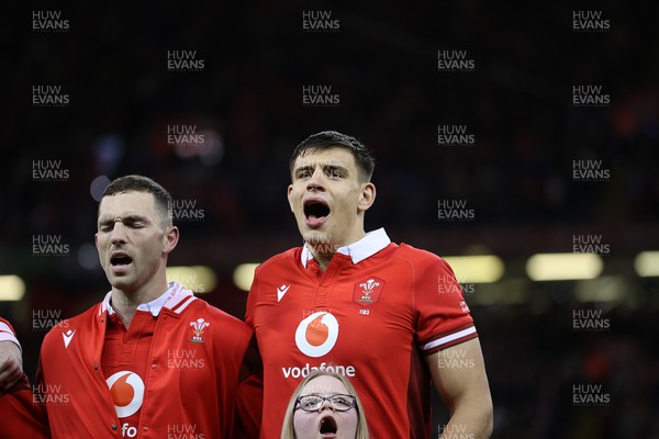 160324 - Wales v Italy - Guinness 6 Nations 2024 - George North and Dafydd Jenkins of Wales sing the anthem