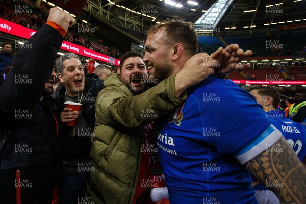 160324 - Wales v Italy - Guinness Six Nations - Italy fans celebrate with players at the end of the match