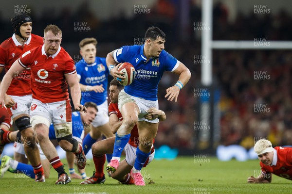 160324 - Wales v Italy - Guinness Six Nations - Tommaso Menoncello of Italy is tackled by Tomos Williams of Wales