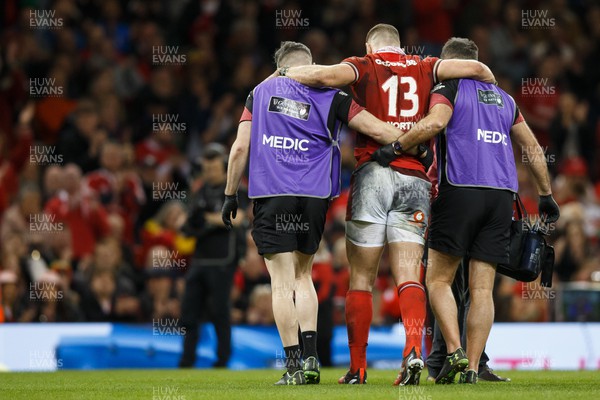 160324 - Wales v Italy - Guinness Six Nations - George North of Wales is helped off the pitch after getting injured