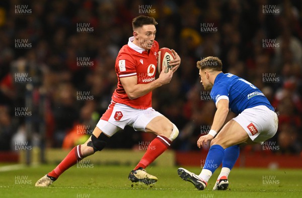 160324 - Wales v Italy - Guinness Six Nations - Josh Adams of Wales looks to break past Stephen Varney of Italy  