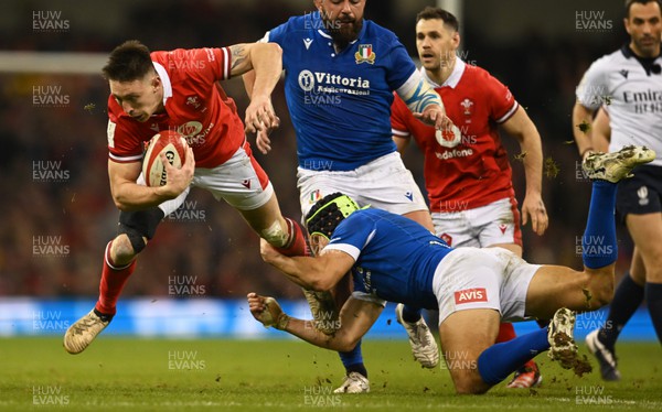 160324 - Wales v Italy - Guinness Six Nations - Josh Adams of Wales  is tackled by Juan Ignacio Brex of Italy  