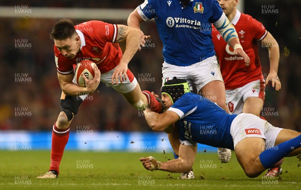 160324 - Wales v Italy - Guinness Six Nations - Josh Adams of Wales  is tackled by Juan Ignacio Brex of Italy  