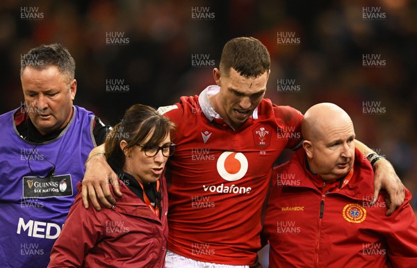 160324 - Wales v Italy - Guinness Six Nations - George North of Wales is helped off an international pitch for the last time after picking up an injury