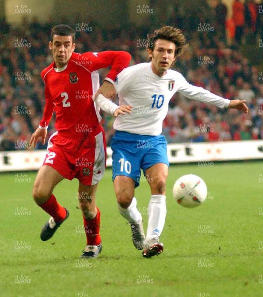 161002 - Wales v Italy - UEFA European Championship Qualifying -  Wales' Mark Delaney battles with Andrea Pirlo