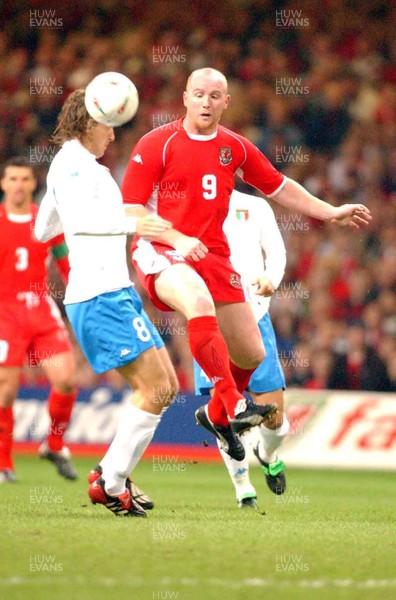 161002 - Wales v Italy - UEFA European Championship Qualifying -  Wales' John Hartson clashes with Massimo Ambrossini