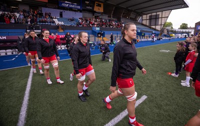 170526 - Wales v Italy, 2026 Guinness Women’s 6 Nations - Natalia John of Wales and Lleucu George of Wales walk out onto the pitch for the start of the match
