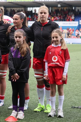 170526 - Wales v Italy, 2026 Guinness Women’s 6 Nations - Bethan Lewis of Wales with match mascot