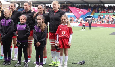 170526 - Wales v Italy, 2026 Guinness Women’s 6 Nations - Bethan Lewis of Wales with match mascot