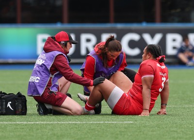 170526 - Wales v Italy, 2026 Guinness Women’s 6 Nations - Dr Gwennan Williams, team doctor and Elin Drake treat Sisilia Tuipulotu of Wales
