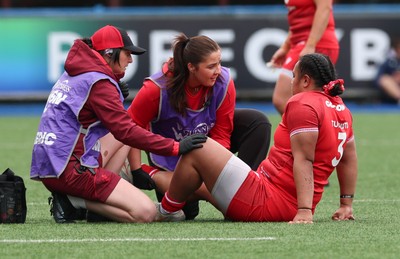 170526 - Wales v Italy, 2026 Guinness Women’s 6 Nations - Dr Gwennan Williams, team doctor and Elin Drake treat Sisilia Tuipulotu of Wales