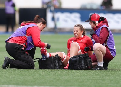 170526 - Wales v Italy, 2026 Guinness Women’s 6 Nations - Elin Drake and Dr Gwennan Williams, team doctor treat Natalia John of Wales
