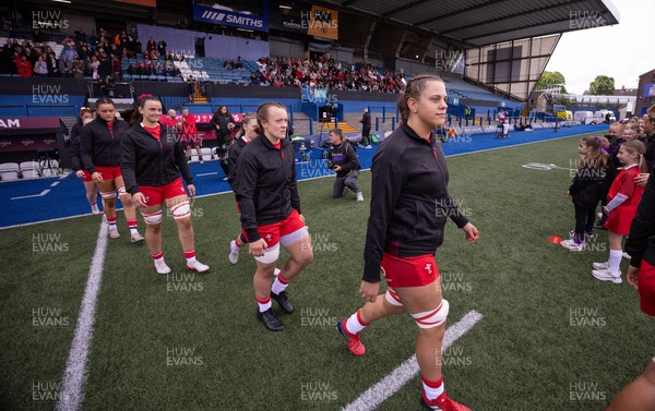 170526 - Wales v Italy, 2026 Guinness Women’s 6 Nations - Natalia John of Wales and Lleucu George of Wales walk out onto the pitch for the start of the match