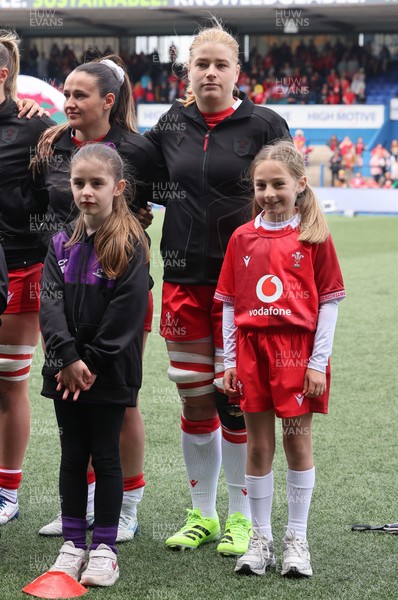 170526 - Wales v Italy, 2026 Guinness Women’s 6 Nations - Bethan Lewis of Wales with match mascot