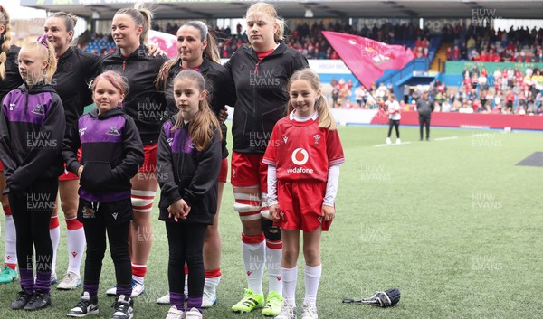 170526 - Wales v Italy, 2026 Guinness Women’s 6 Nations - Bethan Lewis of Wales with match mascot