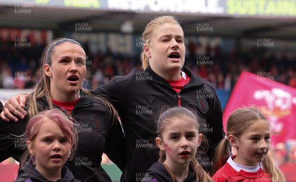 170526 - Wales v Italy, 2026 Guinness Women’s 6 Nations - Kayleigh Powell of Wales and Bethan Lewis of Wales during the anthems