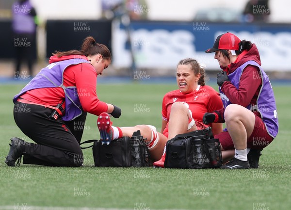 170526 - Wales v Italy, 2026 Guinness Women’s 6 Nations - Elin Drake and Dr Gwennan Williams, team doctor treat Natalia John of Wales