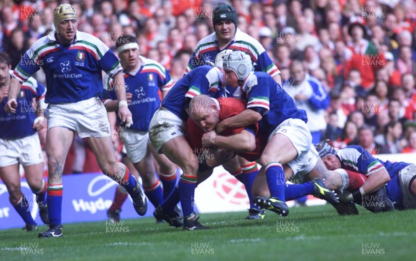 190200 - Wales v Italy - Six Nations -  Craig Quinnell of Wales is tackled by the Italian defence