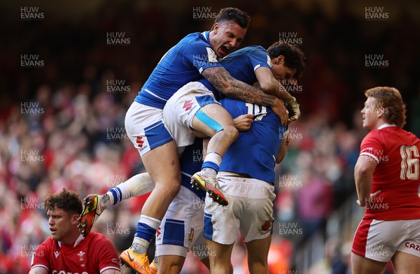 190322 - Wales v Italy - Guinness 6 Nations - Edoardo Padovani of Italy celebrates with team mates after scoring the match winning try