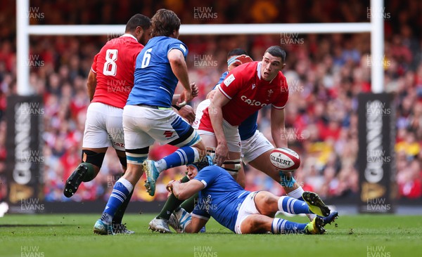 190322 Wales v Italy, Guinness Six Nations 2022 - Seb Davies of Wales looks to off load as he is tackled