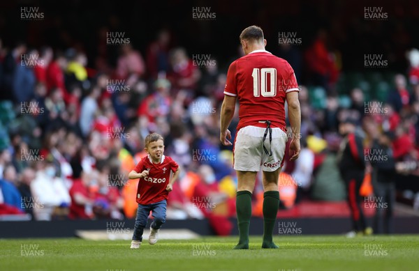 190322 Wales v Italy, Guinness Six Nations 2022 - Dan Biggar of Wales with his son James on the Principality Stadium pitch after the match