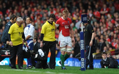 20.03.10 - Wales v Italy - RBS Six Nations 2010 - Bradley Davies of Wales is helped off by Physio Mark Davies. 