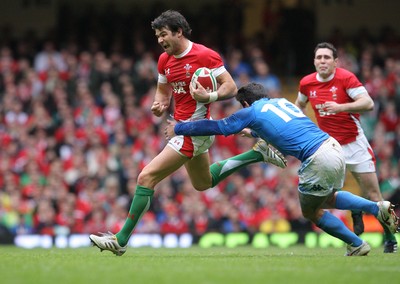 19.03.10 Wales v Italy... Wales Mike Phillips evades tackle by Italy's Craig Gower. 