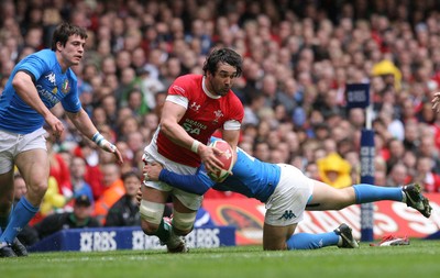 19.03.10 Wales v Italy... Wales Jonathan Thomas is tackled by Italy's Mauro Bergamasco. 