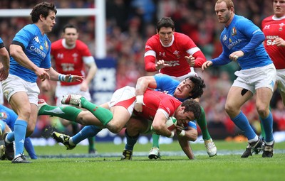 20.03.10 ... Wales v Italy, RBS 6 Nations 2010 -  Wales' Jamie Roberts is tackled by Italy's Pablo Canavosio  