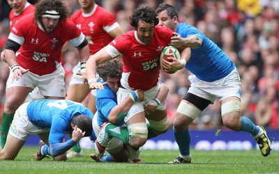 20.03.10 ... Wales v Italy, RBS 6 Nations 2010 -  Wales' Jonathan Thomas is brought down just short of the line 