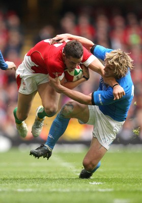 20.03.10 ... Wales v Italy, RBS 6 Nations 2010 -  Wales' Lee Byrne is tackled by Italy's Mirco Bergamasco    