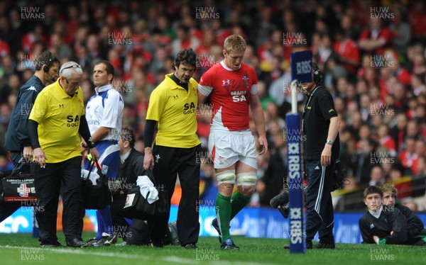 20.03.10 - Wales v Italy - RBS Six Nations 2010 - Bradley Davies of Wales is helped off by Physio Mark Davies. 