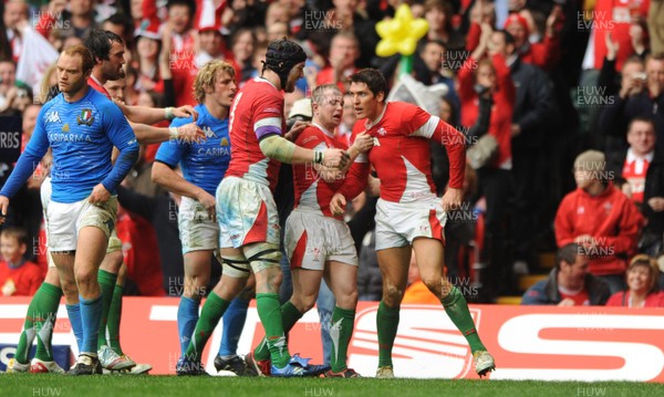 20.03.10 - Wales v Italy - RBS Six Nations 2010 - James Hook of Wales celebrates his try with Ryan Jones and Shane Williams. 