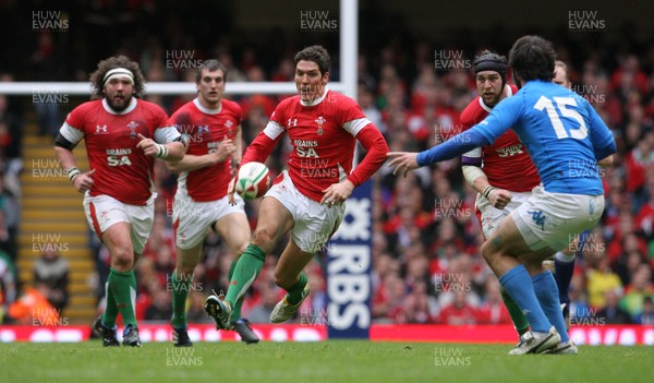 19.03.10 Wales v Italy... WalesJames Hook chips Italy's Luke McLean. 