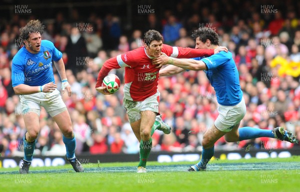 20.03.10 - Six Nations Rugby, Wales v Italy Wales' James Hook hands off Italy's Alessandro Zanni 