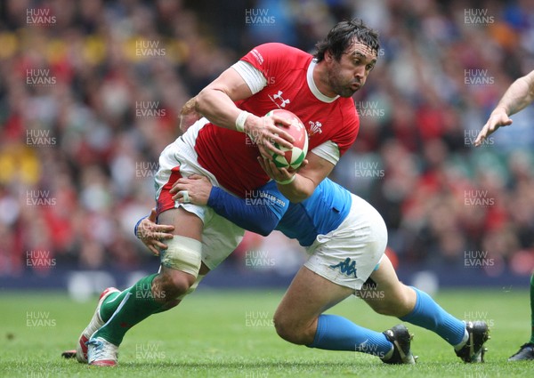 20.03.10 ... Wales v Italy, RBS 6 Nations 2010 -  Wales' Jonathan Thomas is is tackled by Italy's Gonzalo Garcia  