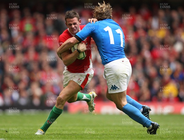 20.03.10 ... Wales v Italy, RBS 6 Nations 2010 -  Wales' Lee Byrne is tackled by Italy's Mirco Bergamasco    