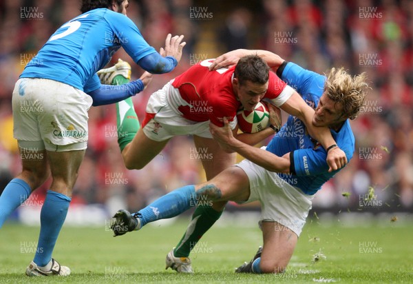 20.03.10 ... Wales v Italy, RBS 6 Nations 2010 -  Wales' Lee Byrne is tackled by Italy's Mirco Bergamasco    