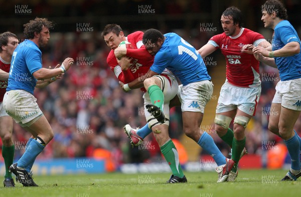 20.03.10 ... Wales v Italy, RBS 6 Nations 2010 -  Wales' Gareth Delve is tackled by Italy's Manoa Vosawai  