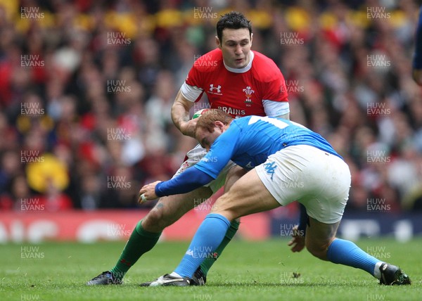 20.03.10 ... Wales v Italy, RBS 6 Nations 2010 -  Wales' Stephen Jones takes on Italy's Gonzalo Garcia  