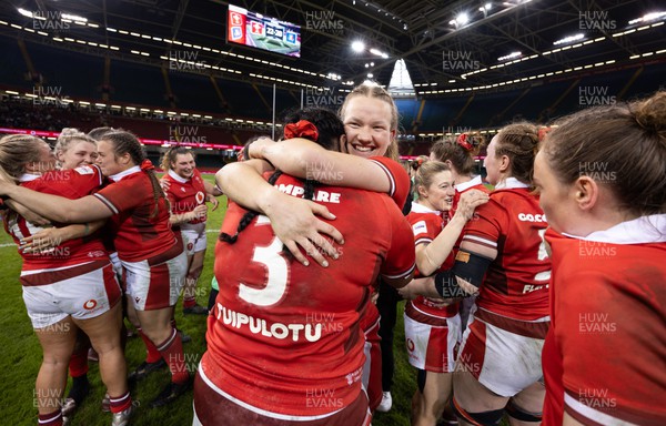 270424 - Wales v Italy, Guinness Women’s 6 Nations - Carys Cox of Wales celebrates with Sisilia Tuipulotu of Wales at the end of the match