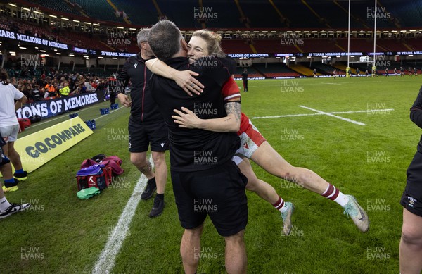 270424 - Wales v Italy, Guinness Women’s 6 Nations - Keira Bevan of Wales celebrates with Shaun Connor, Wales Women attack coach, at the end of the match