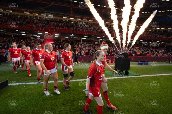 270424 - Wales v Italy, Guinness Women’s 6 Nations - Hannah Jones of Wales walks out with mascot Nia Mair Webb for the start of the match