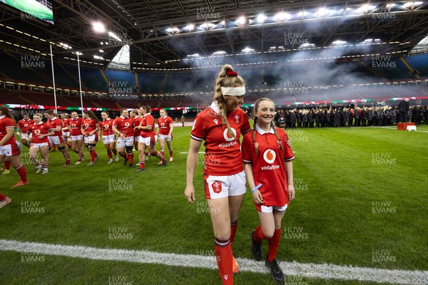 270424 - Wales v Italy, Guinness Women’s 6 Nations - Hannah Jones of Wales with mascot Nia Mair Webb after the anthems
